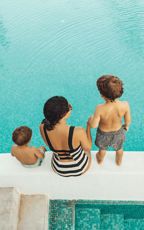 Woman with her children in the pool